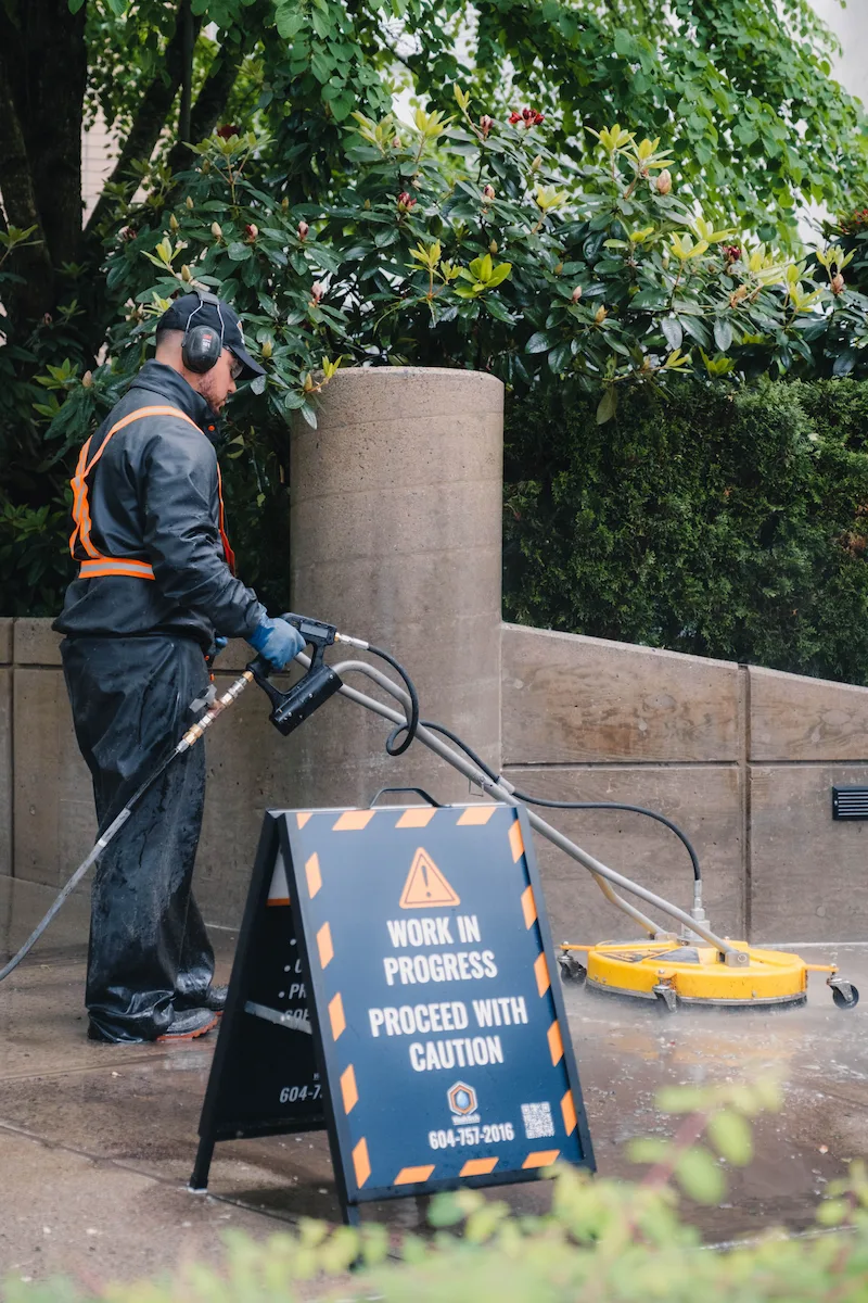 A driveway being pressure washed