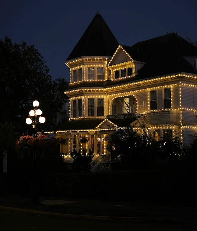 Christmas light installation in winter
